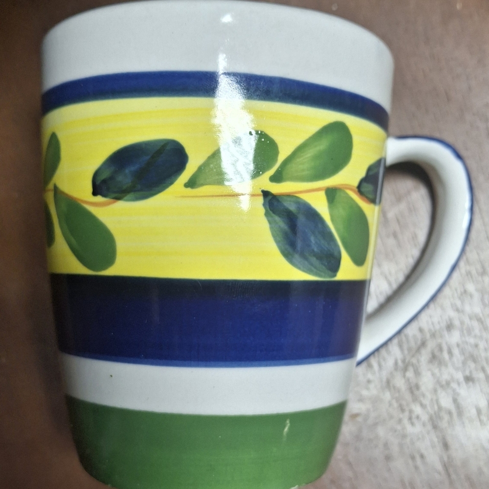 TRISA hand-painted stoneware mugs